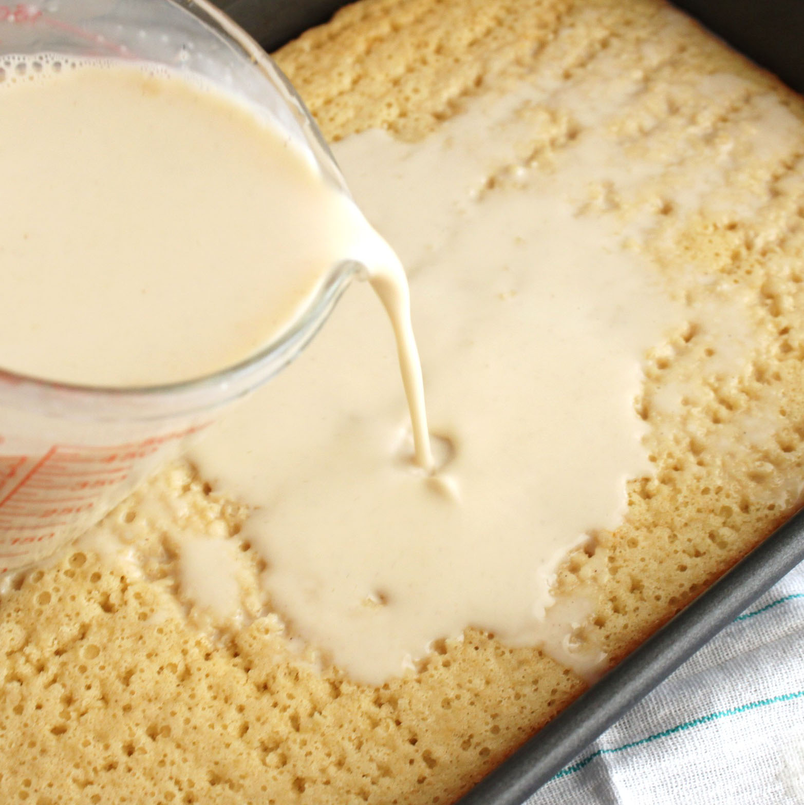finished cake with milk poured over